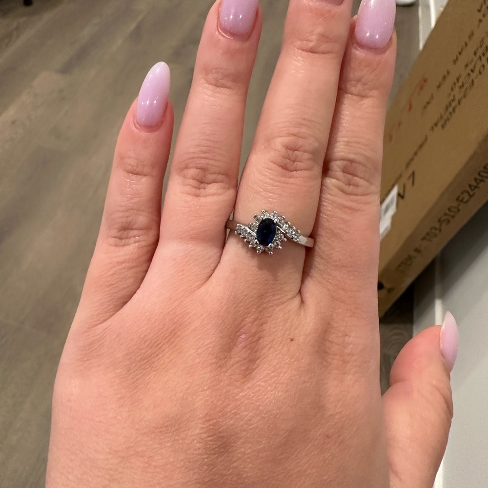 Blue ruby ring with diamonds around